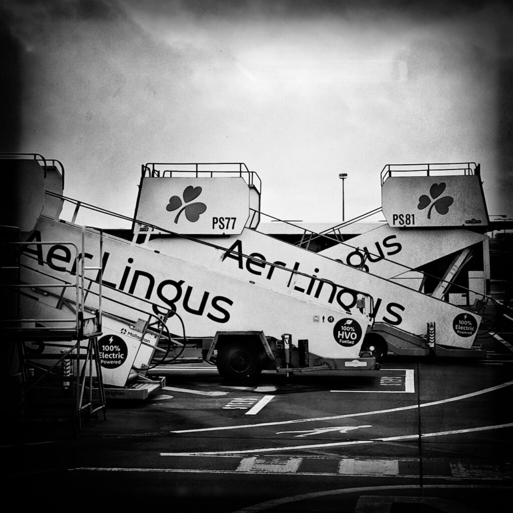 black and white image of portable airline stairs taken at the Dublin Airport.